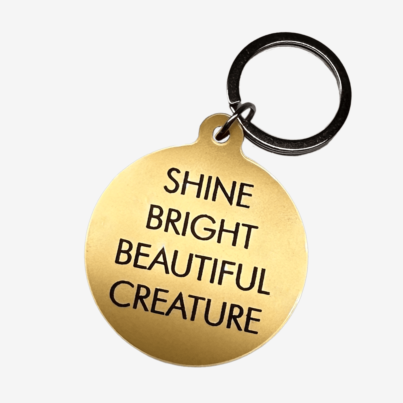 Gi nøkkelknippet et løft med denne nøkkelringen av akryl med gravering og sølvnøkkelring med teksten Shine bright beautiful creature